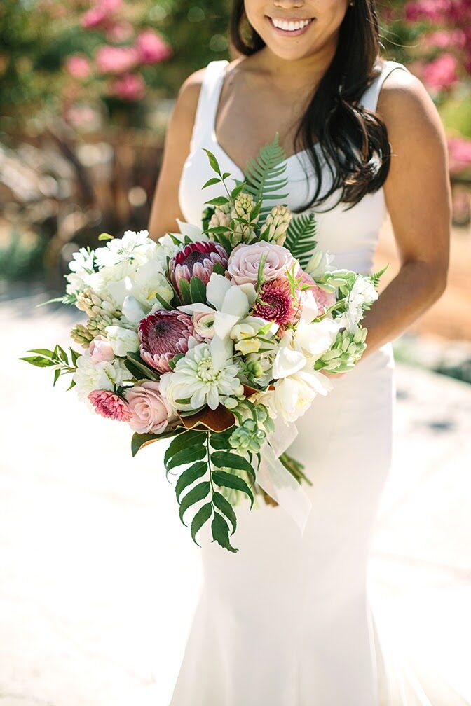 Bride on a mountain road in a flowing gown